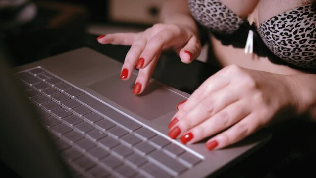 Digital Connection: Webcam Girl Engaged in Laptop Work, Semi-Nude