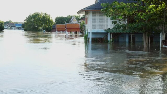 Flooding in community areas in Thailand,Water from the river flooded the house.