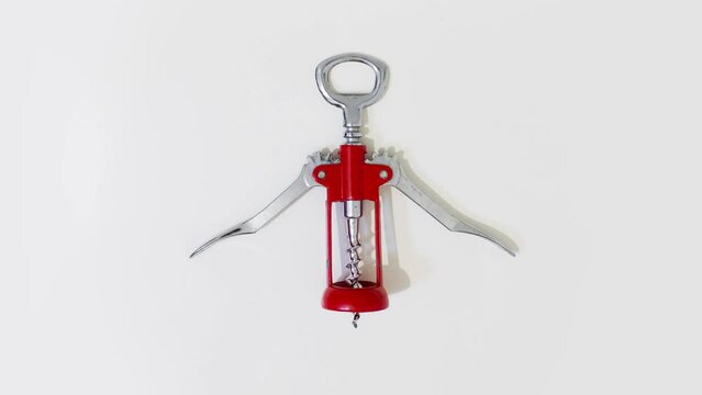 Wine corkscrew opens and closes