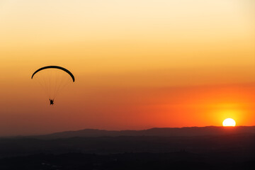 Paragliding during sunset. Pedra Grande, located in Atibaia, Brazil