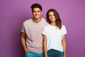 Naklejka premium Studio photo of a happy couple in love against a plain colorful background - catching a moment of endearment