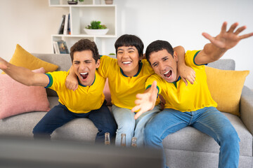 Friends excitedly shouting a Brazil goal