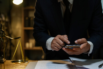 judge on wooden table And experienced lawyers meet with clients and give advice behind the scenes. legal services legal consulting concept