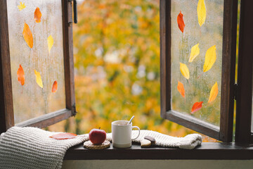Sweet Home. Still life details in home on a wooden window. Sweater, hot tea and autumn decor. Autumn home decor. Cozy fall mood. Thanksgiving. Halloween. Cozy autumn or winter concept.