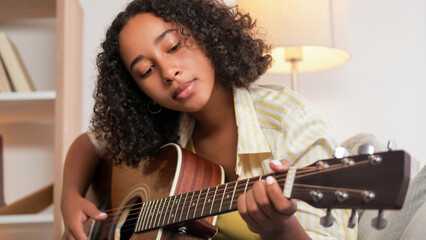Guitar singing. Music leisure. Creative lifestyle. Talented woman singer playing song performing...