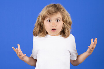Shocked funny kid boy on studio isolated background. Surprised face, excited emotions of child....