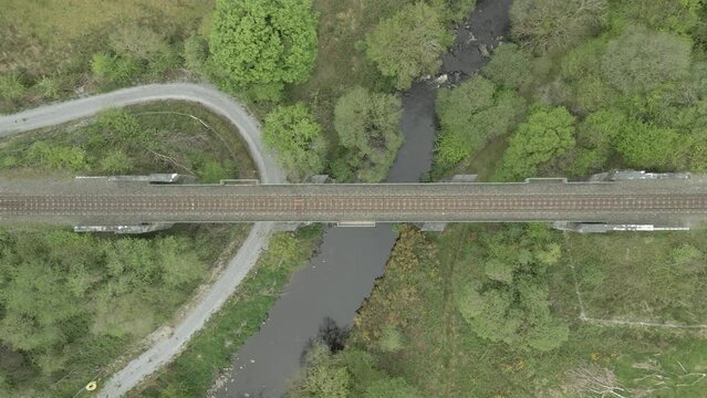 Straight leading symmetrical railway bridge at countryside Kerry Ireland 