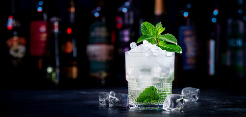 London Mint Swizzle alcohol cocktail drink with dry gin, lemon juice, sugar syrup, soda, mint and...