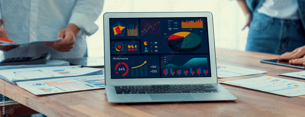 Leinwandbilder focus bi power dashboard display on laptop screen with blurred background of analyst team analyzing 