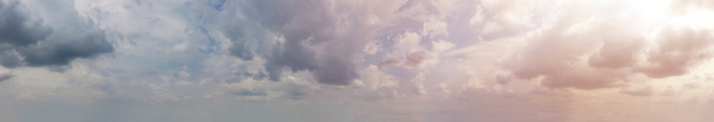 Overcast sky and soft red light adds a touch of magic to the sky, making it a captivating sight to behold, Panorama view.