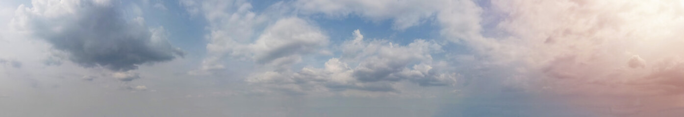 Fototapeta premium Overcast sky casts a soft, diffused light upon the clouds, creating a serene and captivating atmosphere, Panorama view.
