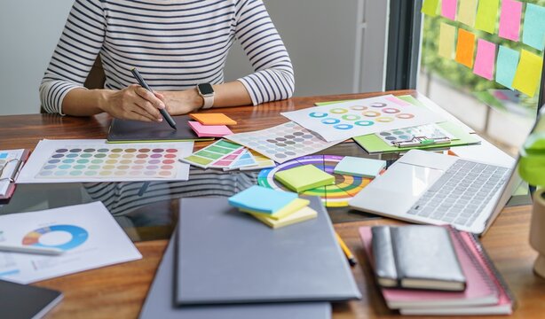 Teamwork brainstorming Creative idea Business project. Business People meeting taking notes while discussing with Color swatch samples to share idea