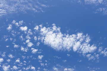 Fototapeta na wymiar White clouds and clear sky on a fine day
