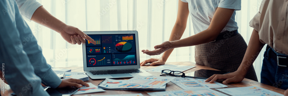 Leinwandbilder panorama shot analyst team utilizing bi fintech to analyze financial report with laptop. businesspeo