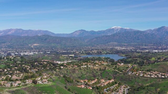 Aerial view of the Puddingstone Reservoir with Los Angeles area cityscape