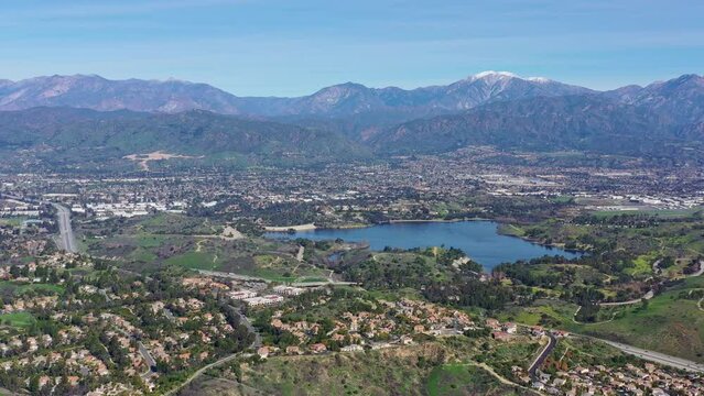 Aerial view of the Puddingstone Reservoir with Los Angeles area cityscape