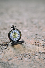 close up pocket watch on stone, nature copy space background, planning and manage to success business concept