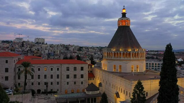 Aerial footage of the Basilica of the Annunciation over the old city houses of Nazareth