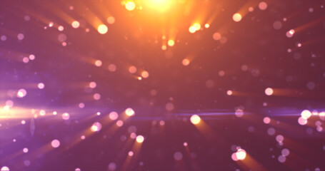 Abstract background of yellow orange gold glowing particles and bokeh dots of festive energy magic