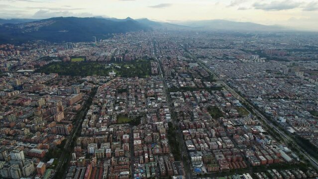 Aerial Drone Establishing Shot Of Vast Large Latin American Flat Cityscape During Afternoon Daylight