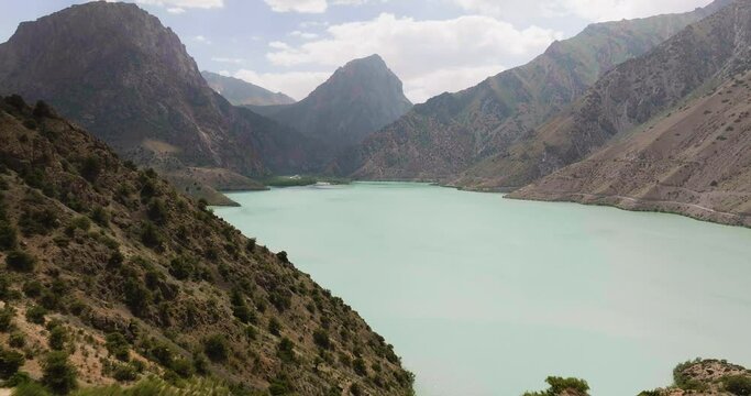 Scenic View Of Iskanderkul Lake In Tajikistan - drone shot