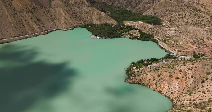 Aerial View Of Iskanderkul Lake In The Heart Of Tajikistan Mountains - drone shot