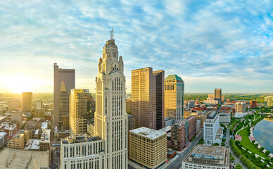 Panorama aerial sunlight at sunrise striking iconic skyscrapers in heart of downtown Columbus Ohio