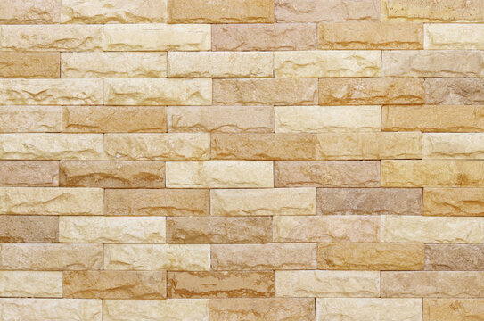 Sandstone brick wall texture with vintage style for background and design art work.