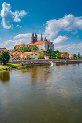 Fototapeta premium Famous ancient Meissen Castle, Fortress and Cathedral near Dresden at Elbe river. Sunny summer day with blue sky and sunset colors