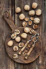 Walnuts  on rustic old wooden table, top view