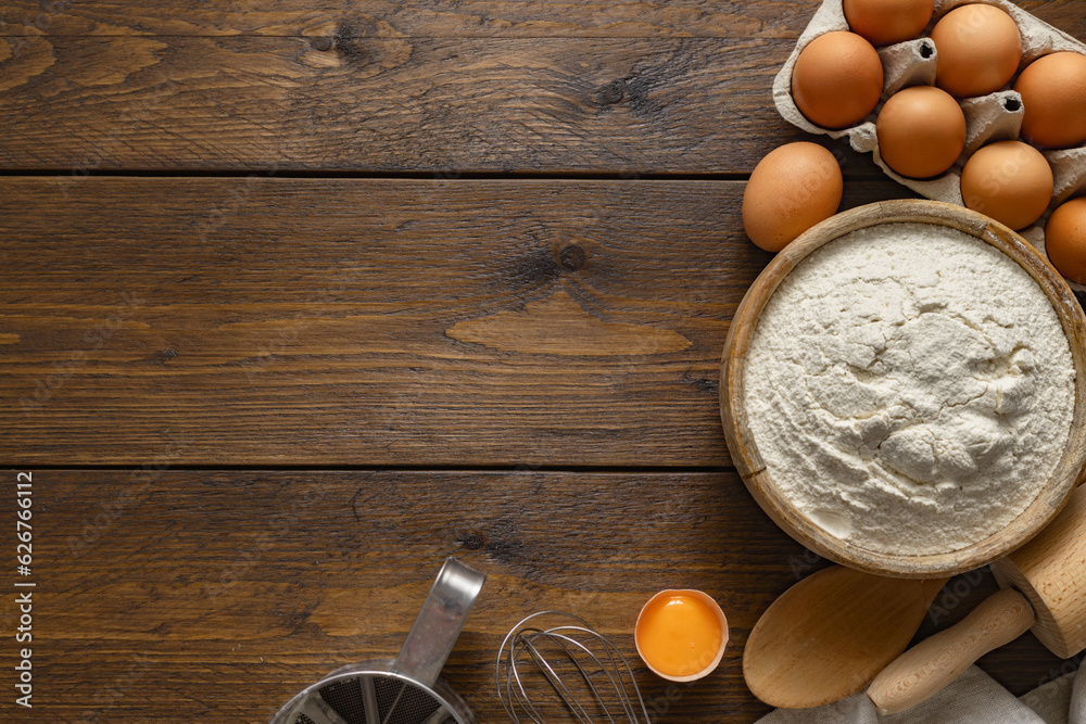 Poster ingredients for cooking dough on wooden table in a bakery with copy space top view