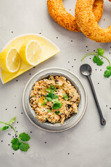 Vegan chickpea hummus spread with lemon and bagel