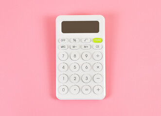  flat lay of white  calculator on pink background with copy space. - obrazy, fototapety, plakaty