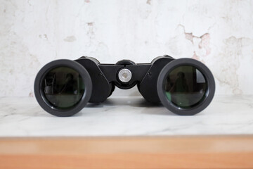 Binoculars on an isolated white background. Zoom binocular for astronomy observation or military 