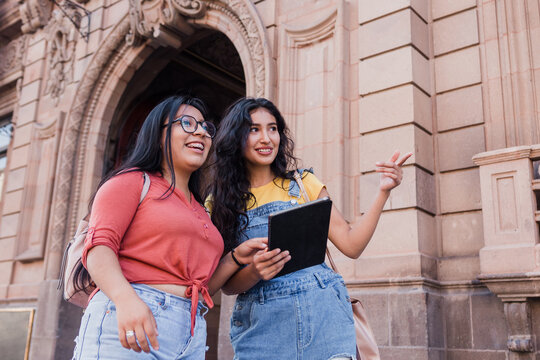 Two Young Latin Girls University Students In Mexico Latin America, Hispanic Girls Studying Outdoors