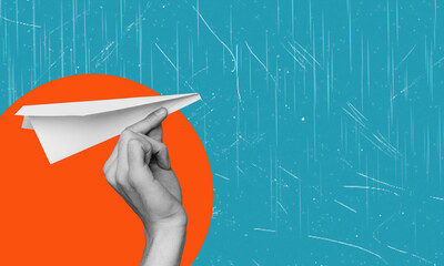 Hand holding a paper plane on a circle background. Ideas for travel.