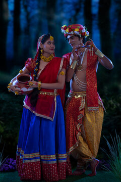 Young man and woman dressed up as Radha and Krishna on the occasion of Janmashtami