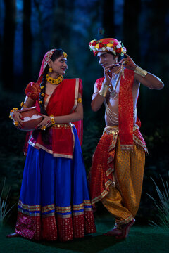 Young man and woman dressed up as Radha and Krishna on the occasion of Janmashtami