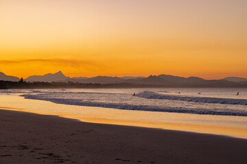 Fototapeta na wymiar Sunset beach views across Main Beach in Byron Bay, New South Wales, Eastern Australia