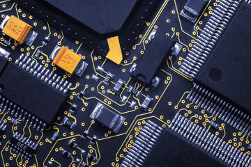 Closeup of Printed Circuit Board with processor, integrated circuits and many other surface mounted...