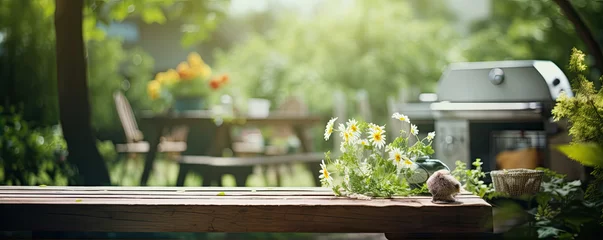 Foto op Canvas summer time in backyard. Grill in garden on wooden table. © amazingfotommm