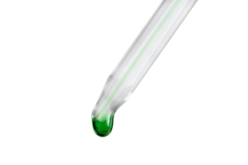 Green drop flowing out of a pipette isolated on a transparent background.