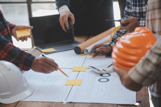 Engineer Teamwork Meeting, Drawing working on blueprint meeting for project working with partner on model building and engineering tools in working site, Construction and structure concept.