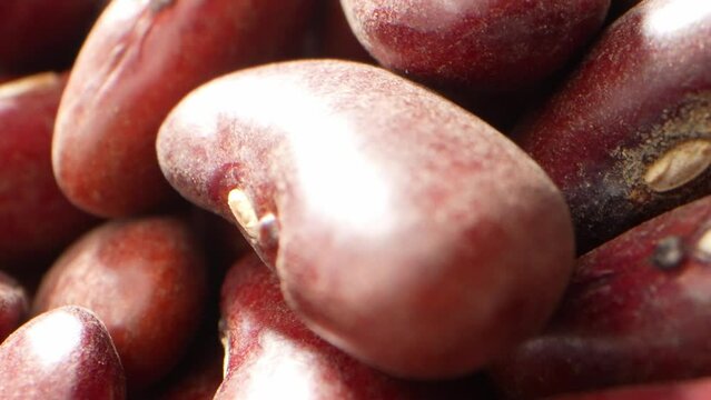Red kidney beans are small, kidney-shaped legumes with a vibrant red color. Through a probe lens, their textured surface appears smooth yet slightly bumpy, An excellent addition to various dishes.

