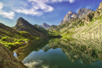 Monviso mirrored in the clear waters of the lake