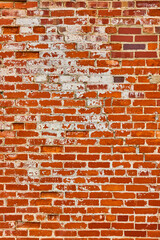 Orange and red brick wall with busted white bricks vertical background asset