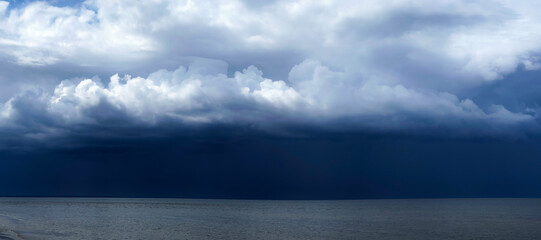 Panorama of the Baltic Gulf with dramatic dark rain clouds before thunder storm over Baltic sea in...