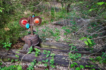 In forest, old railroad track piece, lantern light, gear switch, track changer, train, abandoned, old, colorful