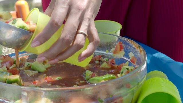 woman serving ceviche fresh aperitive summertime latin american food in a bowl outdoors