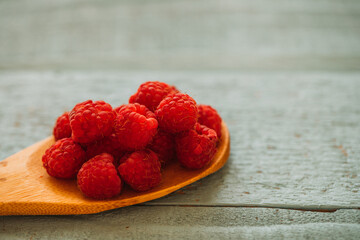 raspberries on a wooden background